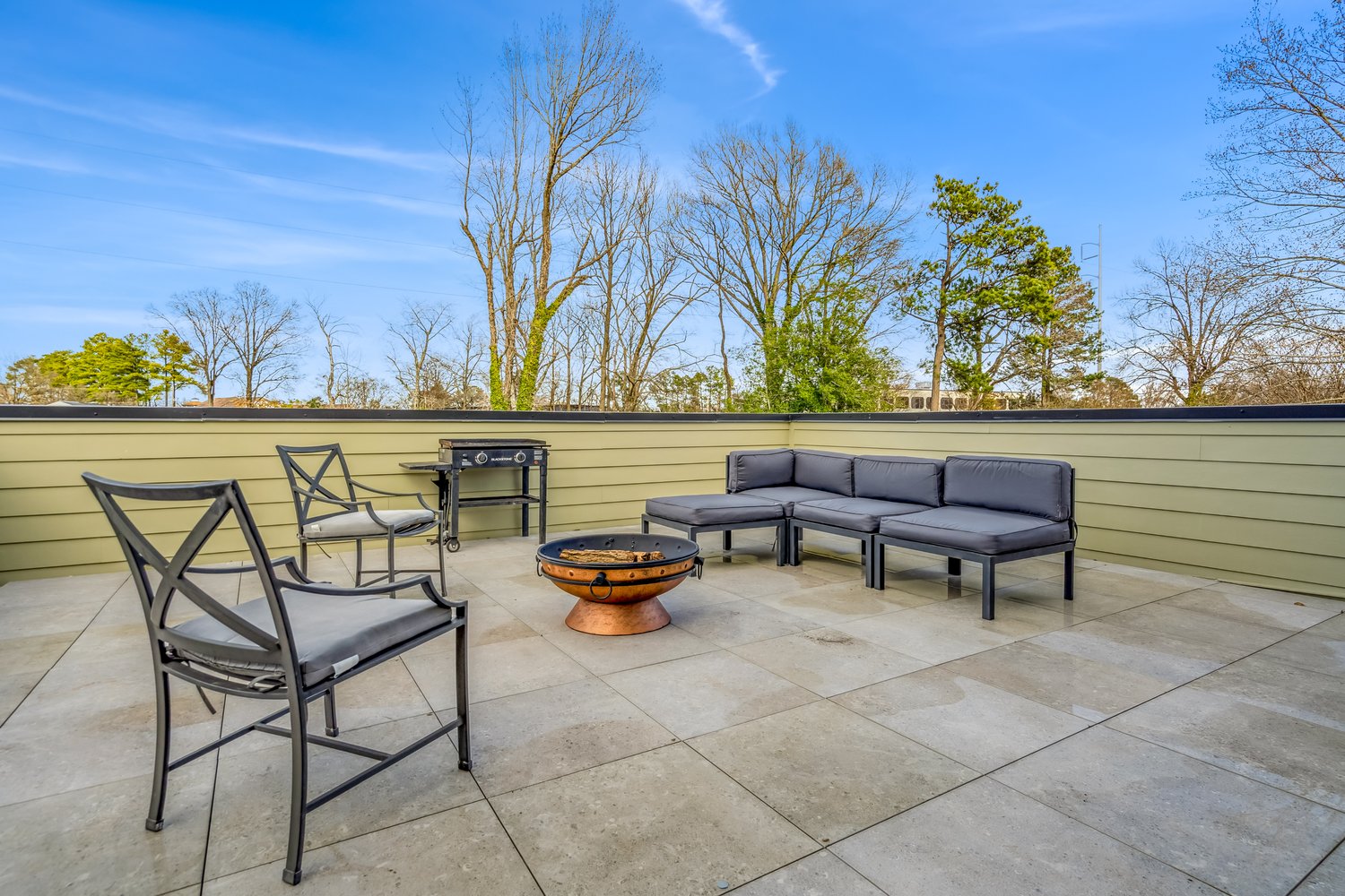 Private rooftop terrace with fire pit and lounge seating